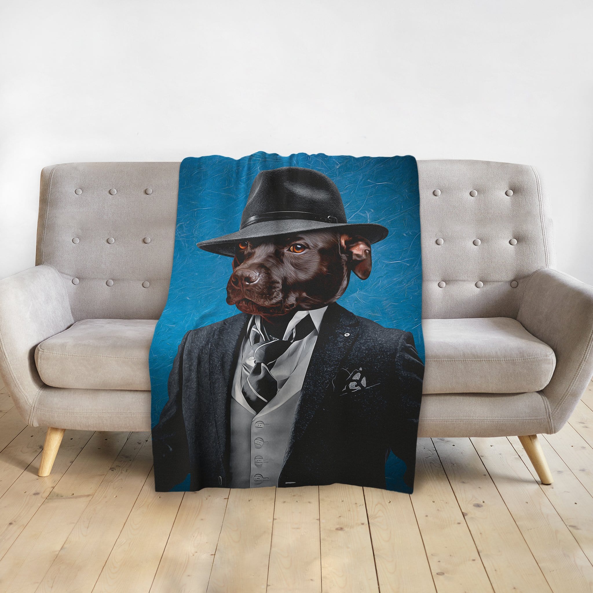 Personalized pet blanket with a chocolate lab in a "Mobster" suit and fedora against a blue background.