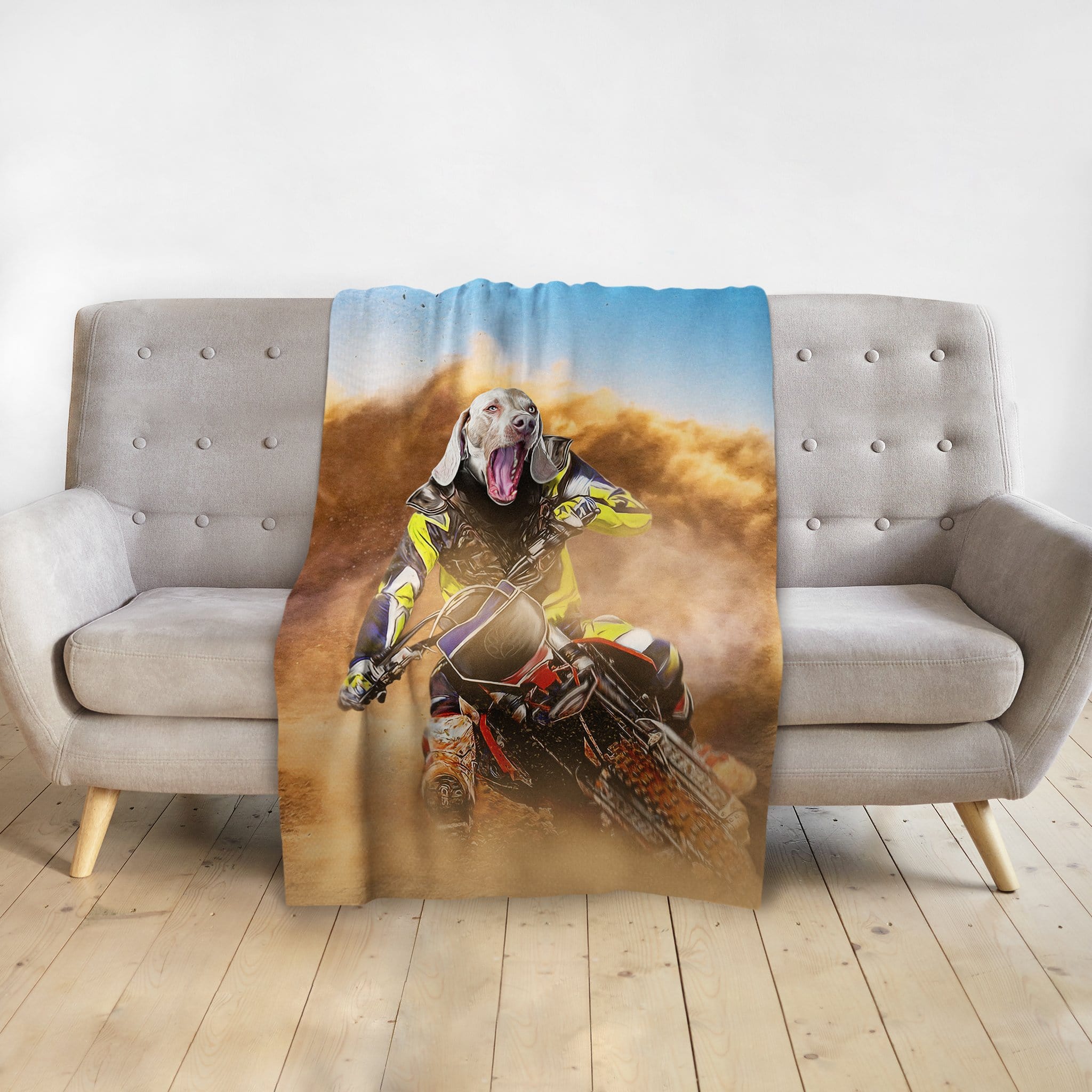 Personalized pet blanket with a custom portrait of a dog as a motocross rider in a dusty desert scene.