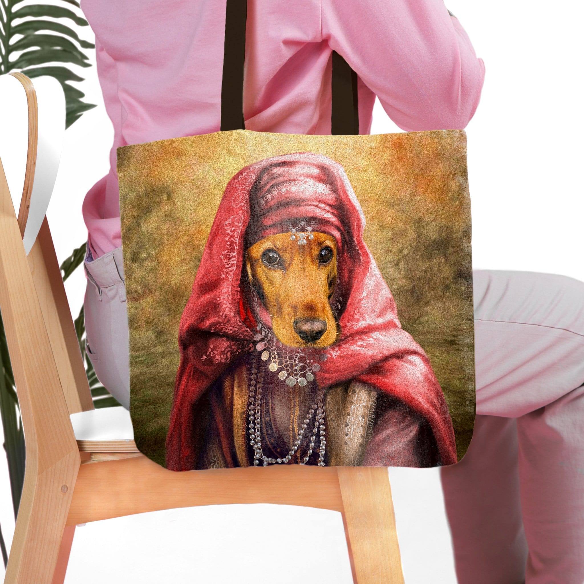 Personalized tote bag featuring a custom royal renaissance portrait of a dachshund dog in a red headscarf.