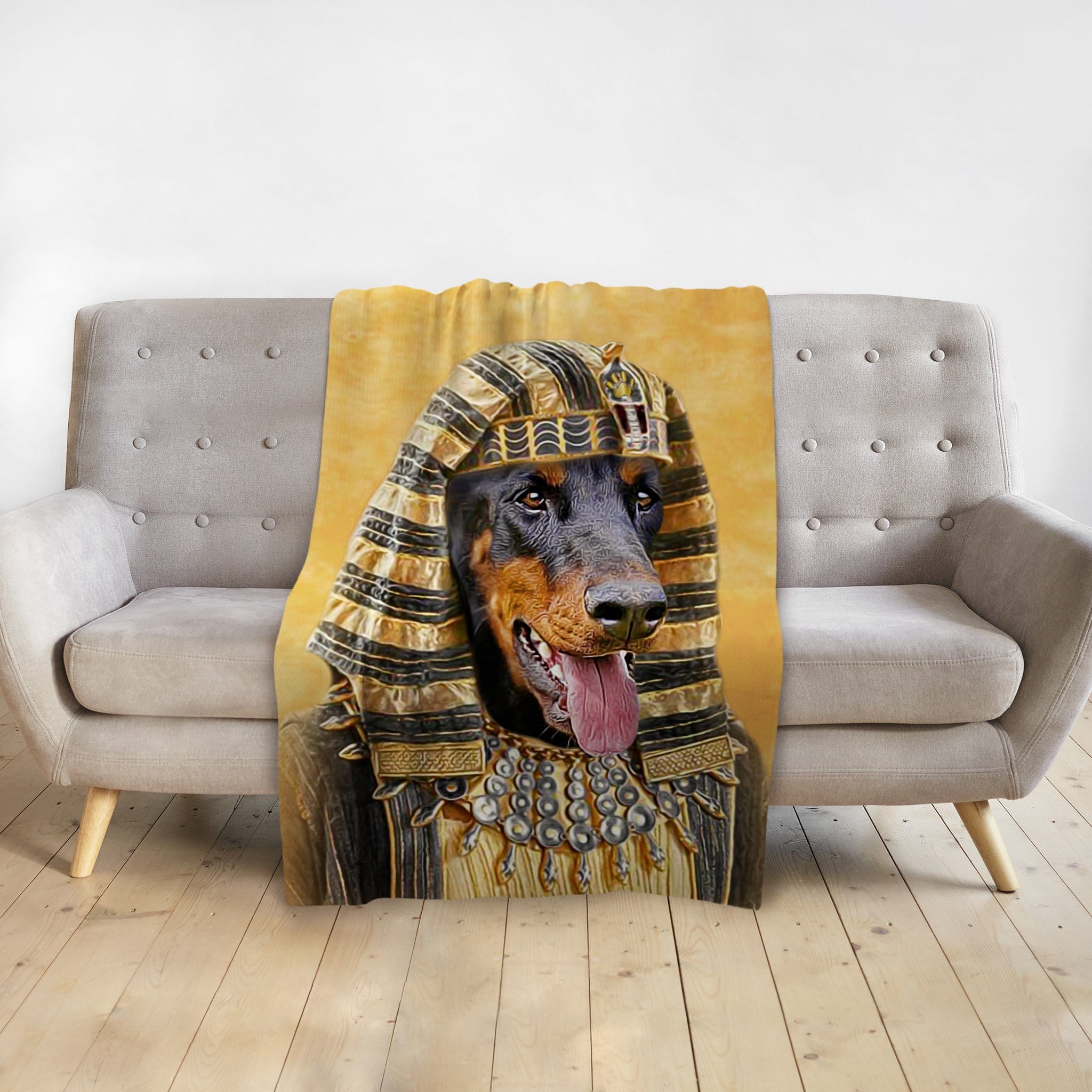 Personalized pet blanket with a Doberman dog in a Pharaoh portrait design on a gray sofa.