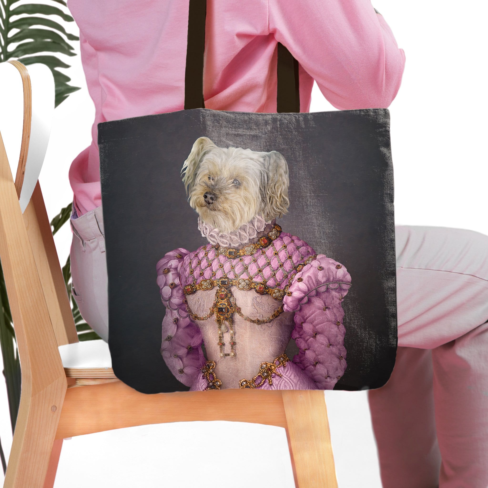 Personalized black tote bag with a custom royal renaissance portrait of a white dog in a pink gown.