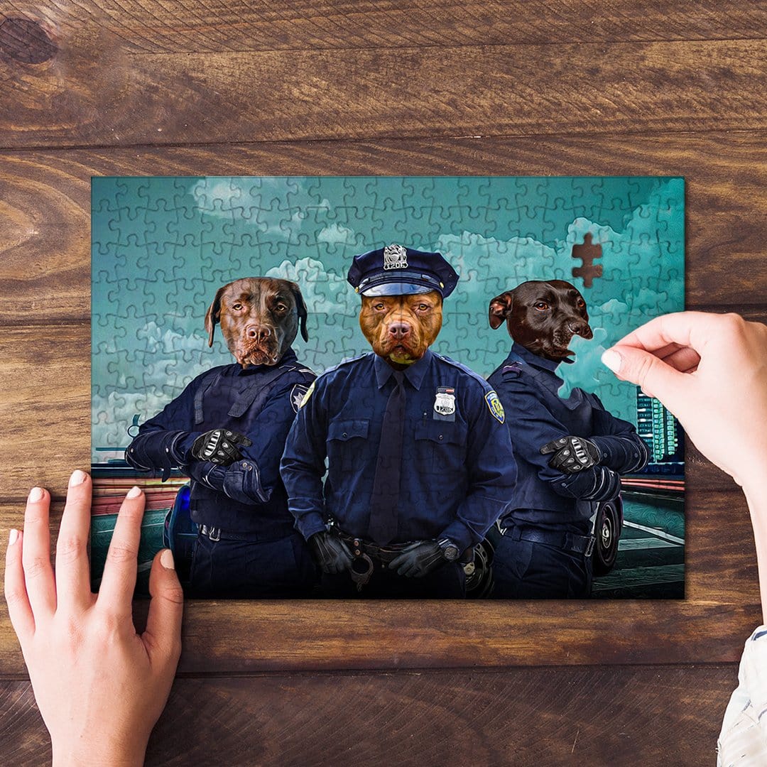 Personalized 3-pet puzzle featuring dogs dressed as police officers, with a hand placing a piece.