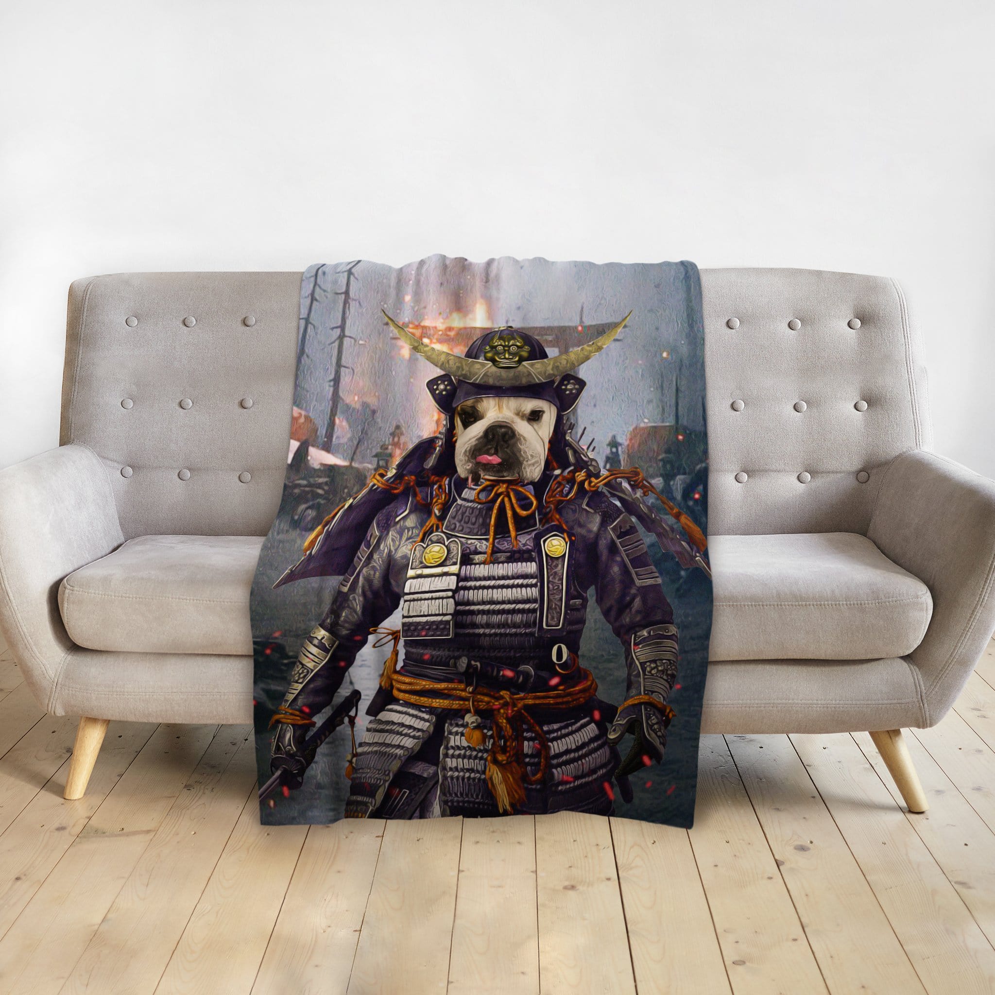 Personalized pet blanket with a French Bulldog in a samurai warrior portrait design, draped over a gray sofa.