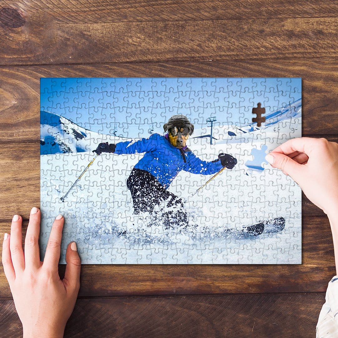 Personalized pet puzzle featuring a dog's face on a skier, with hands assembling pieces.