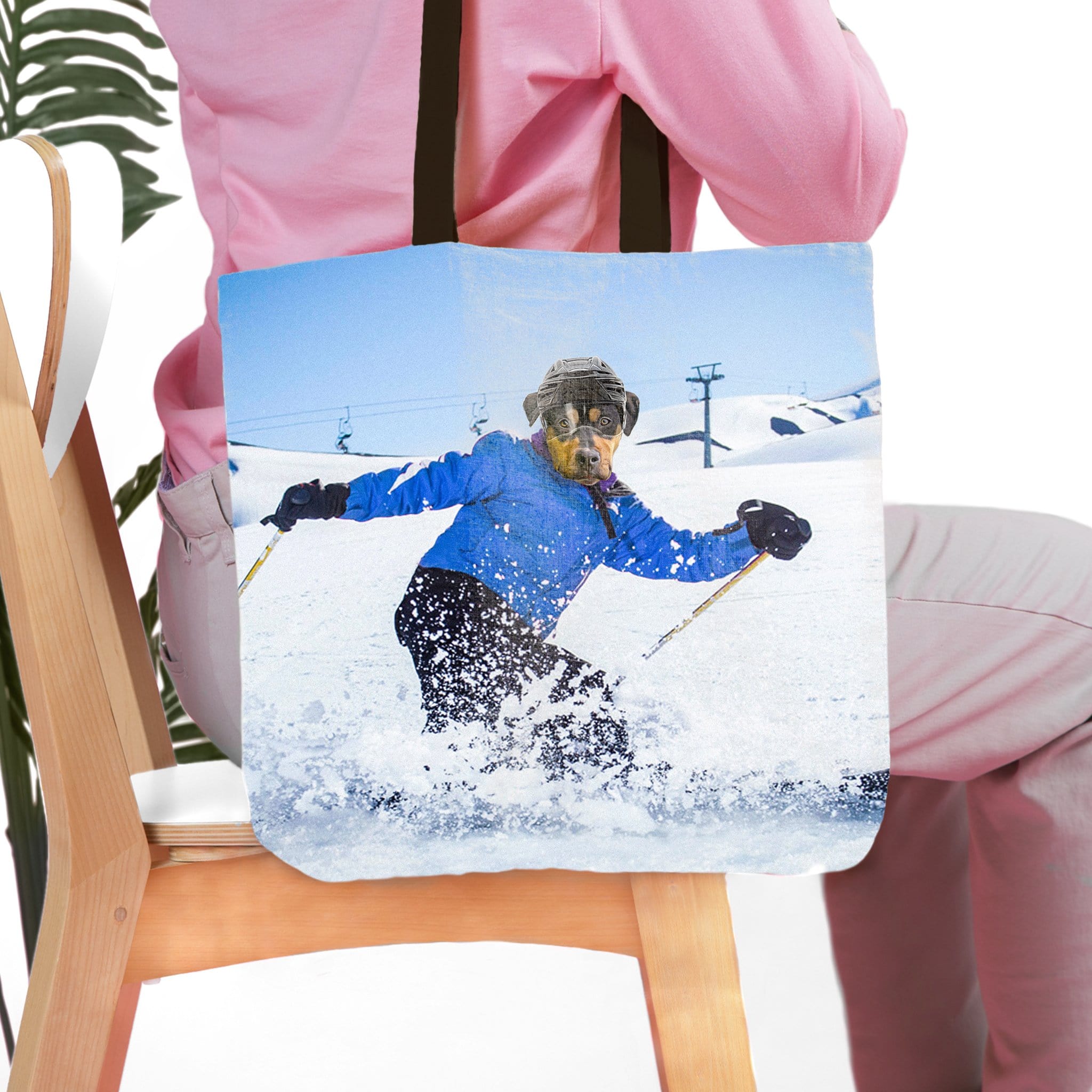 Personalized tote bag with a custom pet portrait of a dog skiing in a blue jacket.