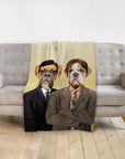 Personalized pet blanket with two dogs in business suits, draped over a gray sofa.