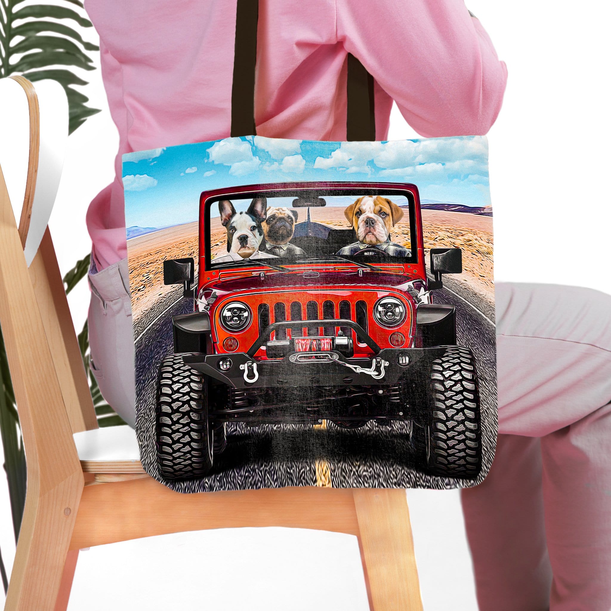Personalized 3-pet tote bag with cartoon dogs in a red jeep on a desert road.