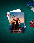 Personalized playing cards featuring two dogs in a Titanic-themed portrait on a green felt table with poker chips and dice.