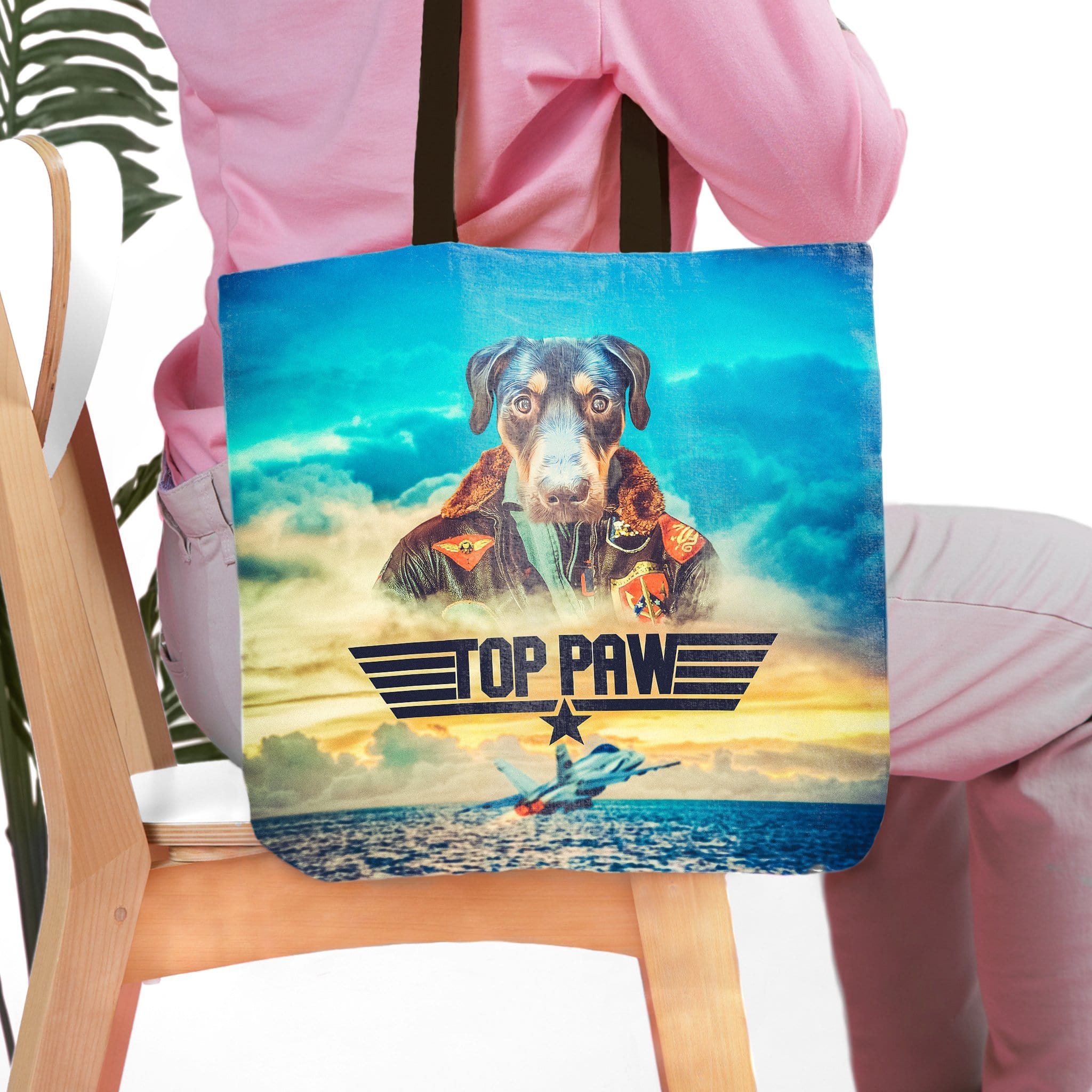 Personalized Top Paw tote bag with a dog pet portrait in a pilot uniform, against a sky background.
