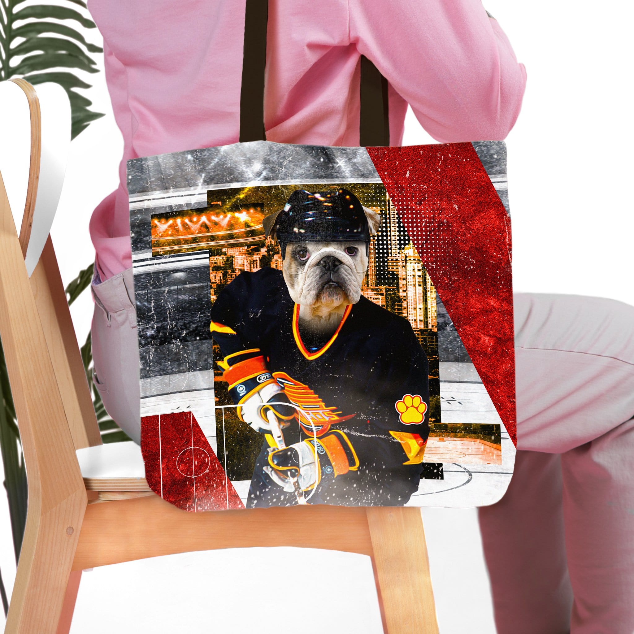 Personalized tote bag with a bulldog pet portrait in a hockey uniform.
