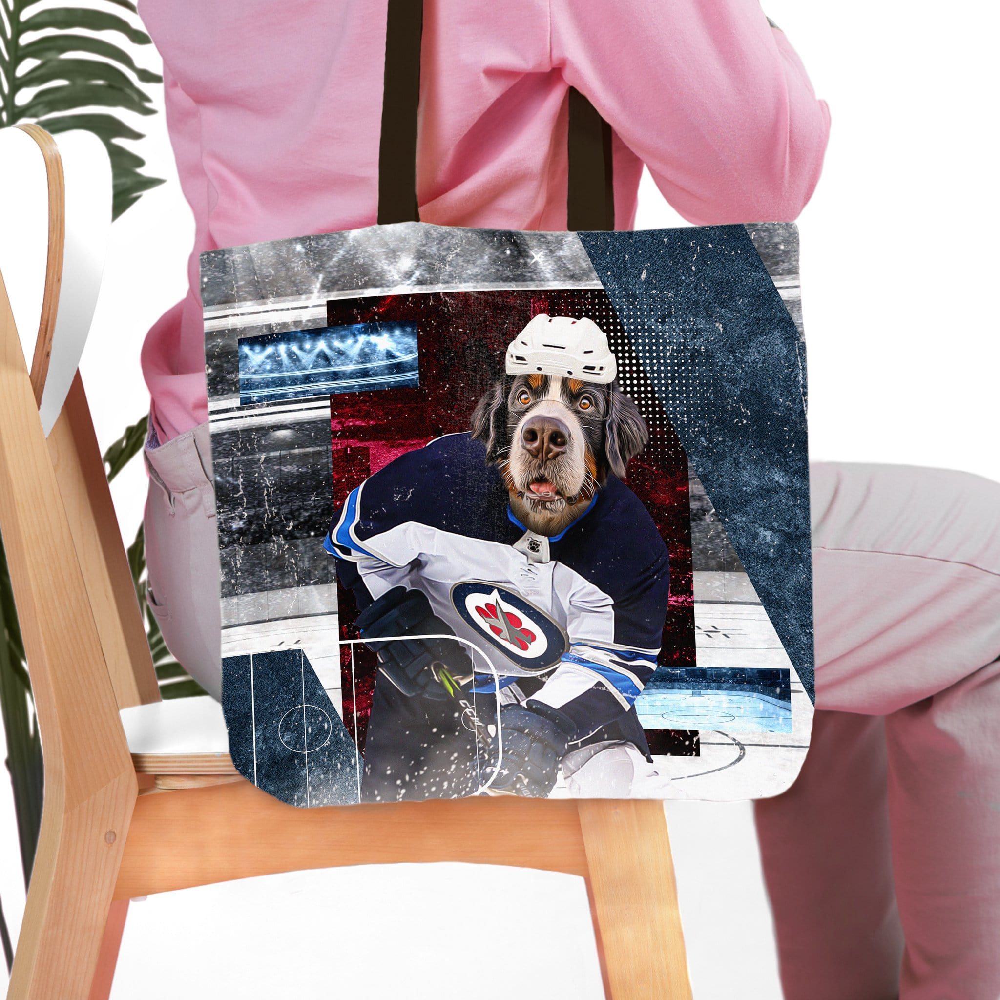 Personalized tote bag with a custom pet portrait of a dog in a hockey uniform.